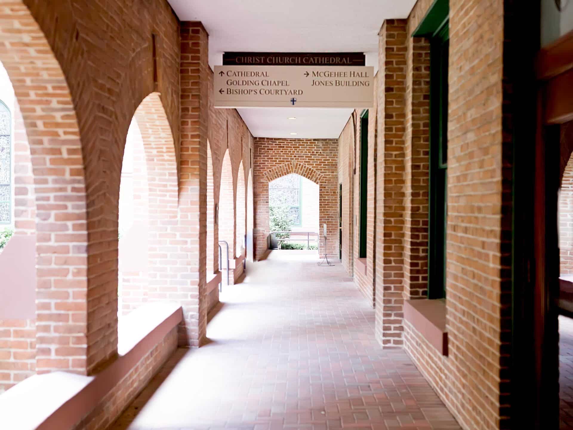Empty exterior brick hallway at Christ Church Cathedral in Houston, TX.